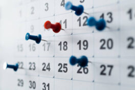 thumbtack-pins-on-a-calendar