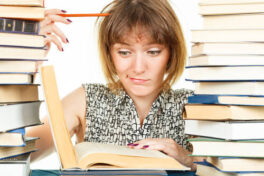 Girl with books isolated on white background. portrait of a student.